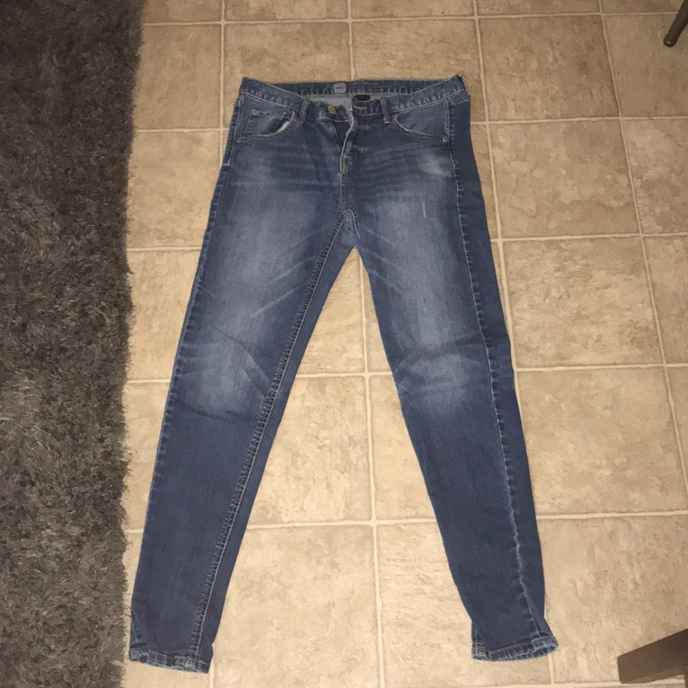 Medium wash blue jeans, slightly distressed